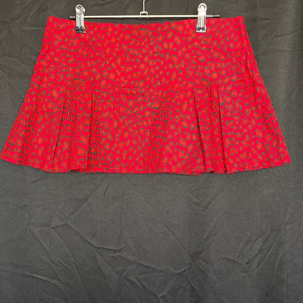 Collectif Red and black animal print pleated mini skirt